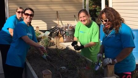 Picture of volunteers helping clean the garden